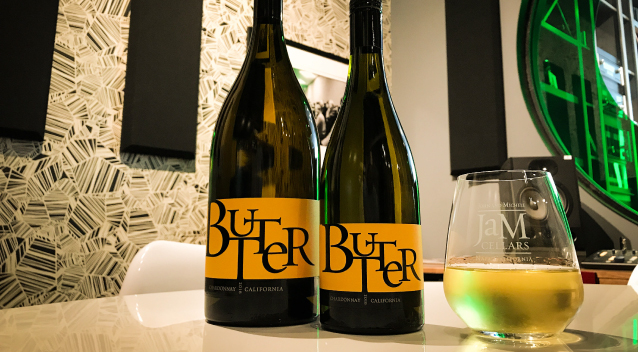 Two bottles of JaM Cellars Butter and glass of wine