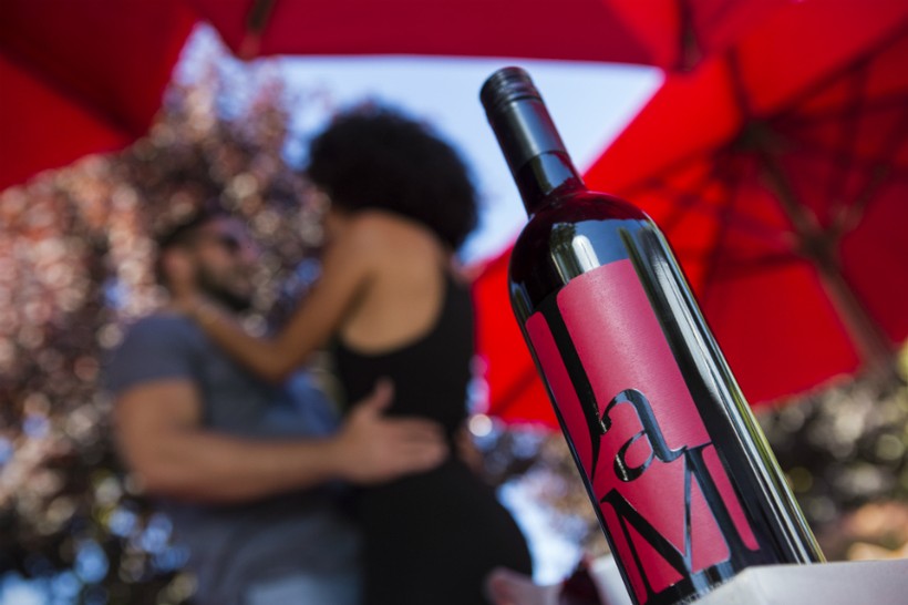Bottle of JaM Cellars Cab with dancing couple in background