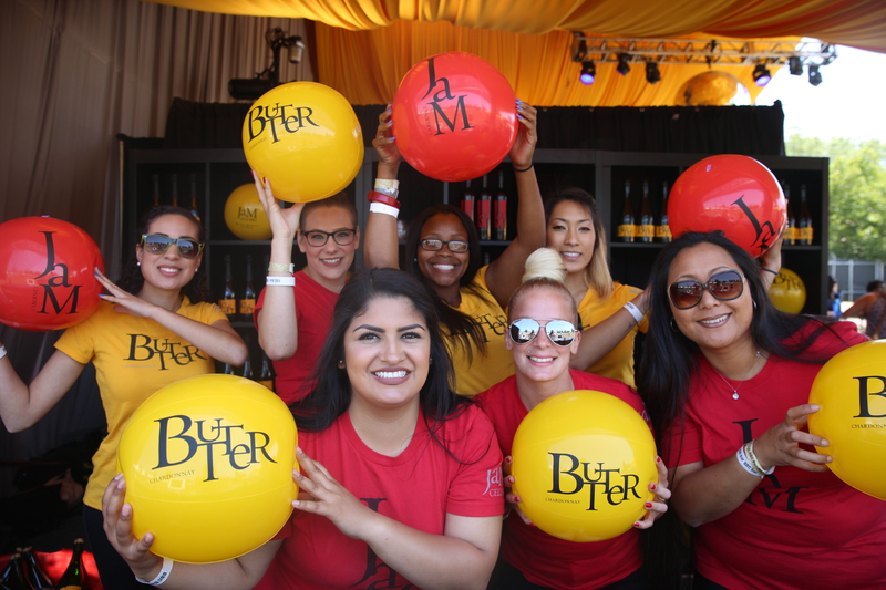 Women wearing JaM Cellars red and yellow t-shirts with Butter balloons