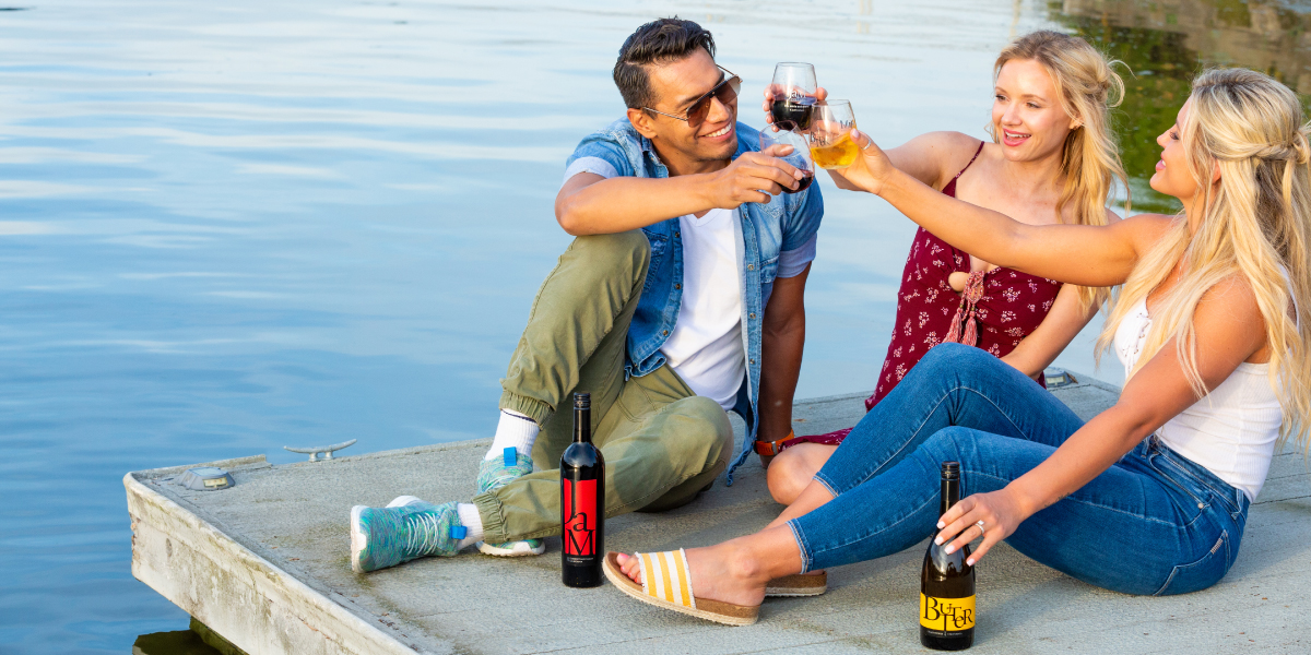 Savoring last sip of JaM Cellars wine on lakeside dock