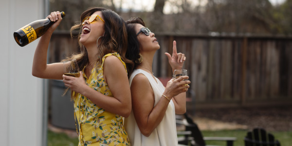 Two moms back-to-back enjoying JaM Cellars Butter wine