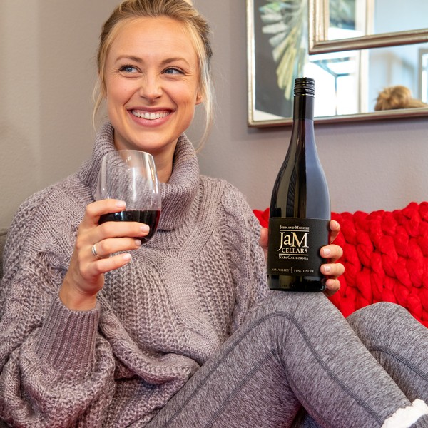 Wearing cozy sweater and enjoying JaM Cellars wine